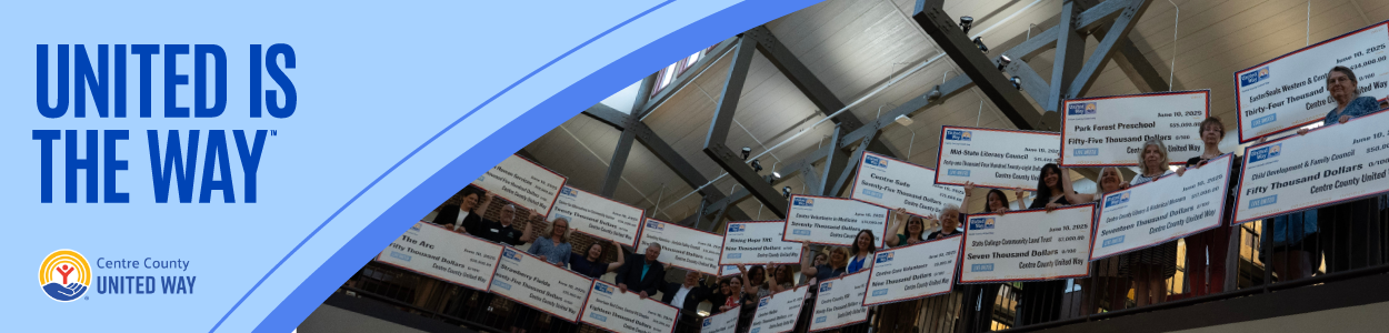 people holding big checks